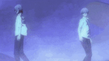 a couple of people walking in a foggy area