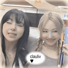 two girls are standing next to each other with their eyes closed and a speech bubble with the word clauliv on it .
