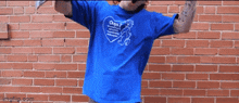 a person wearing a blue shirt that says oops