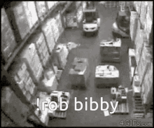 a black and white photo of a warehouse with the words rob bibby