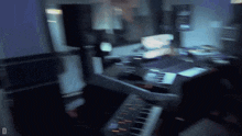 a blurry picture of a person playing a keyboard with the letter d visible in the corner