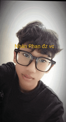 a young man wearing glasses has the name nhan phan dz vc written above his head