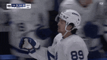 a hockey player wearing the number 89 jersey