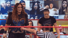 two women in a wrestling ring with one wearing a shirt that says hard seltzer