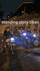 a group of motorcycle riders are standing in front of a stone wall with the words standing story tiban on the bottom
