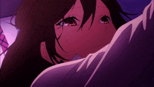 a close up of a woman 's face with a purple background