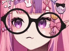 a close up of a girl wearing glasses and a pink hair clip .