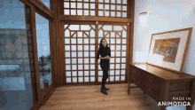 a woman is standing in a room with a sliding glass door made by animatica