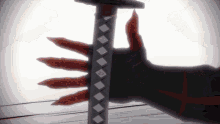 a close up of a person holding a sword