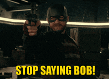 a man pointing a gun with the words stop saying bob written below him