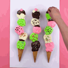 three ice cream cones with different toppings and sprinkles