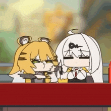 a couple of cartoon characters are sitting at a table eating food .