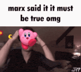 a picture of a man with kirby in front of his face that says ' marx said it it must be true omg '