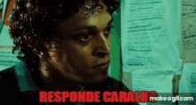 a close up of a man 's face with the words " responde caralho " in red