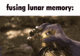 a person is holding a glowing object in their hand that says fusing lunar memory