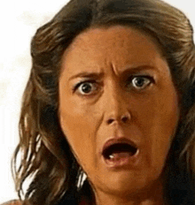 a woman with a surprised look on her face .
