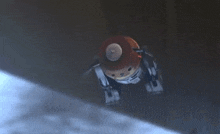a robot is flying through the air with a smoke trail behind it .