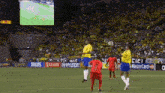 a soccer game is being played on a field with ads for mastercard philips and hyundai