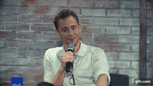 Tom Hiddleston Smile GIF - Tom Hiddleston Smile Content GIFs