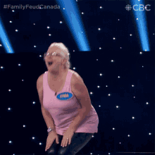 a woman with the name lynda on her shirt is dancing