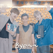 a group of young men standing next to each other with the word bye written in white