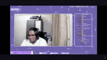 a man is sitting in front of a computer screen with a purple background and the words butikz on it