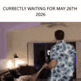 a man in a blue shirt is holding a woman 's hand and says correctly waiting for may 26th 2026 ..