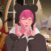 a person with pink hair wearing a black hoodie