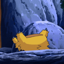 a yellow cartoon character is laying on its back on a rock