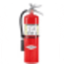 a red fire extinguisher is sitting on top of a white surface .