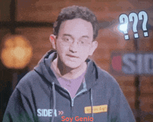 a man wearing a black hoodie that says side and soy genio