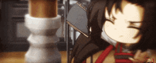 a cartoon character is laying on a table with a book on his lap