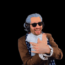 a man wearing sunglasses and an american flag scarf is making a funny face