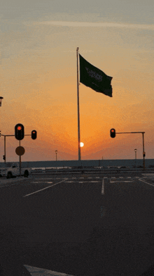 a sign that says welcome to saudi arabia with a sunset in the background