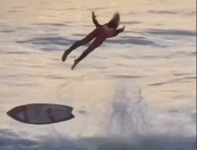 a man in a suit is flying through the air on a hill .