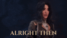 a woman in a leather jacket is standing in front of a sign that says alright then