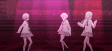 three anime girls are dancing on a stage in front of a pink background .