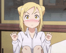a girl with a cat ear on her head is sitting down