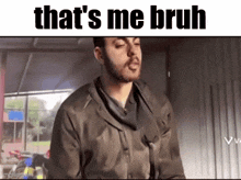 a man with a beard is making a funny face and the caption says that 's me bruh
