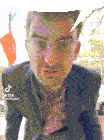 a man wearing glasses and a suit has tiktok written on the bottom right