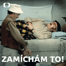a man laying on a bed next to another man with the word zamicham to on the bottom