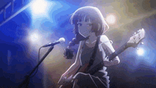 a girl is singing into a microphone while playing a guitar