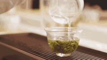 making tea pour water tea tea leaves