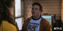 a man is wearing a shirt that says classes beat ass