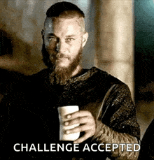 a man with a beard is holding a cup of coffee and the words `` challenge accepted '' are above him .