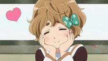 a girl with a bow on her head has her eyes closed