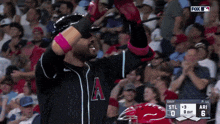 a baseball player with the letter a on his jersey celebrates