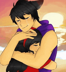 a man and a woman are hugging each other on the beach .