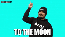 a man wearing a black hoodie and a black beanie says to the moon