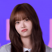 a girl with long hair making a funny face